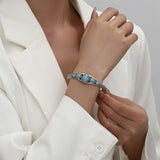 Arabella Open Turquoise-Color Teardrop Bangle | Silver-Tone — image 3