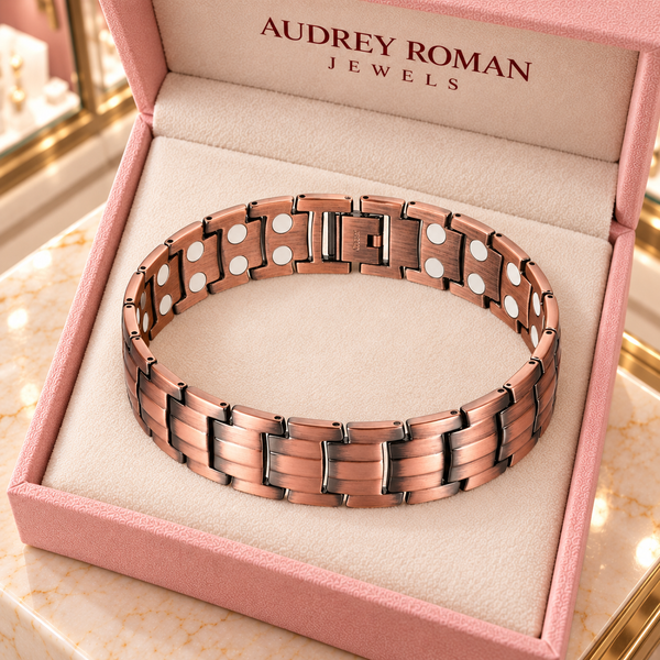 Overhead view of the Clara Chain Bracelet in copper tone in an Audrey Roman Jewels box on the boutique counter.