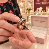 Eleanor Ridge Ring held in a close detail view inside the boutique.