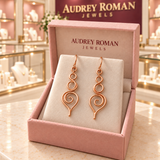 Eleanor Swirl Earrings in its rose Audrey Roman Jewels box inside the boutique.