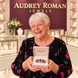 Hazel Purple Crest Ring (rose-gold-tone) presented in its box by the woman in the Audrey boutique.