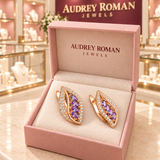 Imogen Earrings (rose-gold-tone) in a rose Audrey Roman Jewels box inside the boutique.
