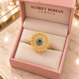 Victoria Blue Sunburst Spinner Ring | Gold-Tone viewed from above in the Audrey boutique.