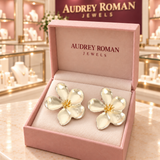 Cassandra silver-tone flower earrings in a rose Audrey Roman Jewels box inside the boutique.