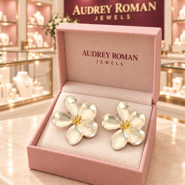 Cassandra silver-tone flower earrings in a rose Audrey Roman Jewels box inside the boutique.