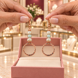 Celia Orb Earrings in the Audrey Roman Jewels boutique — hands