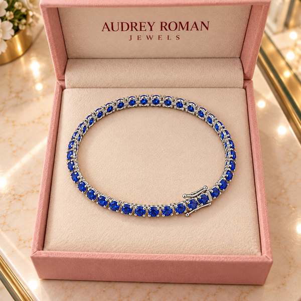 Rosamund Blue Tennis Bracelet | Silver-Tone viewed from above in its Audrey presentation box.