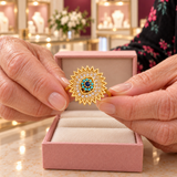 Victoria Blue Sunburst Spinner Ring | Gold-Tone presented close up in the Audrey boutique.